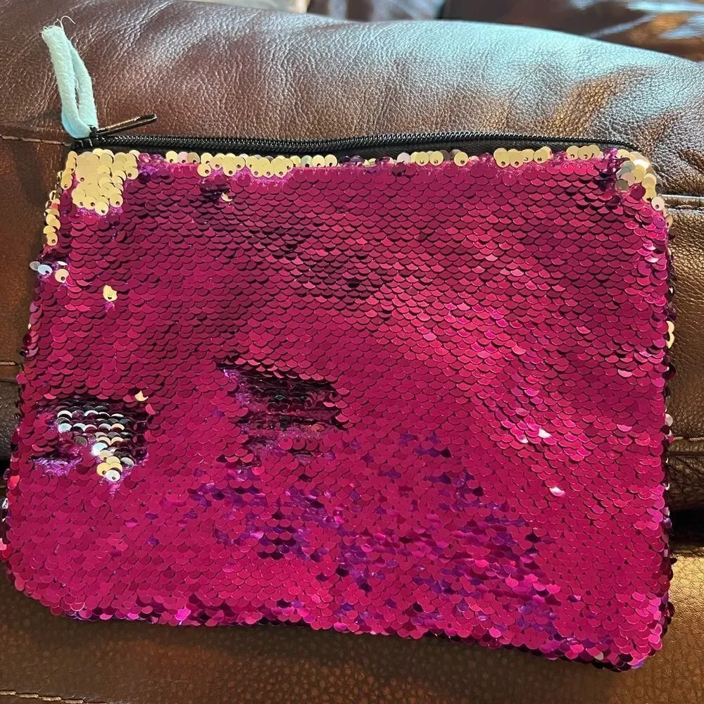 Claire’s color change sequin clutch or cosmetics bag